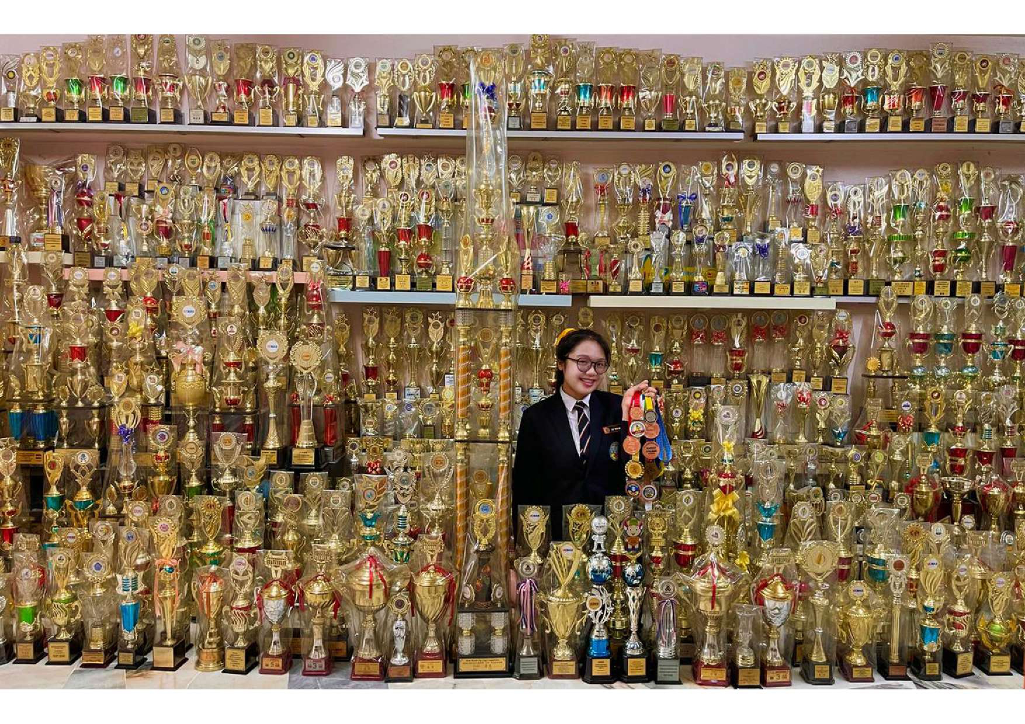 Yap Wen Min with her collection of awards and trophies
